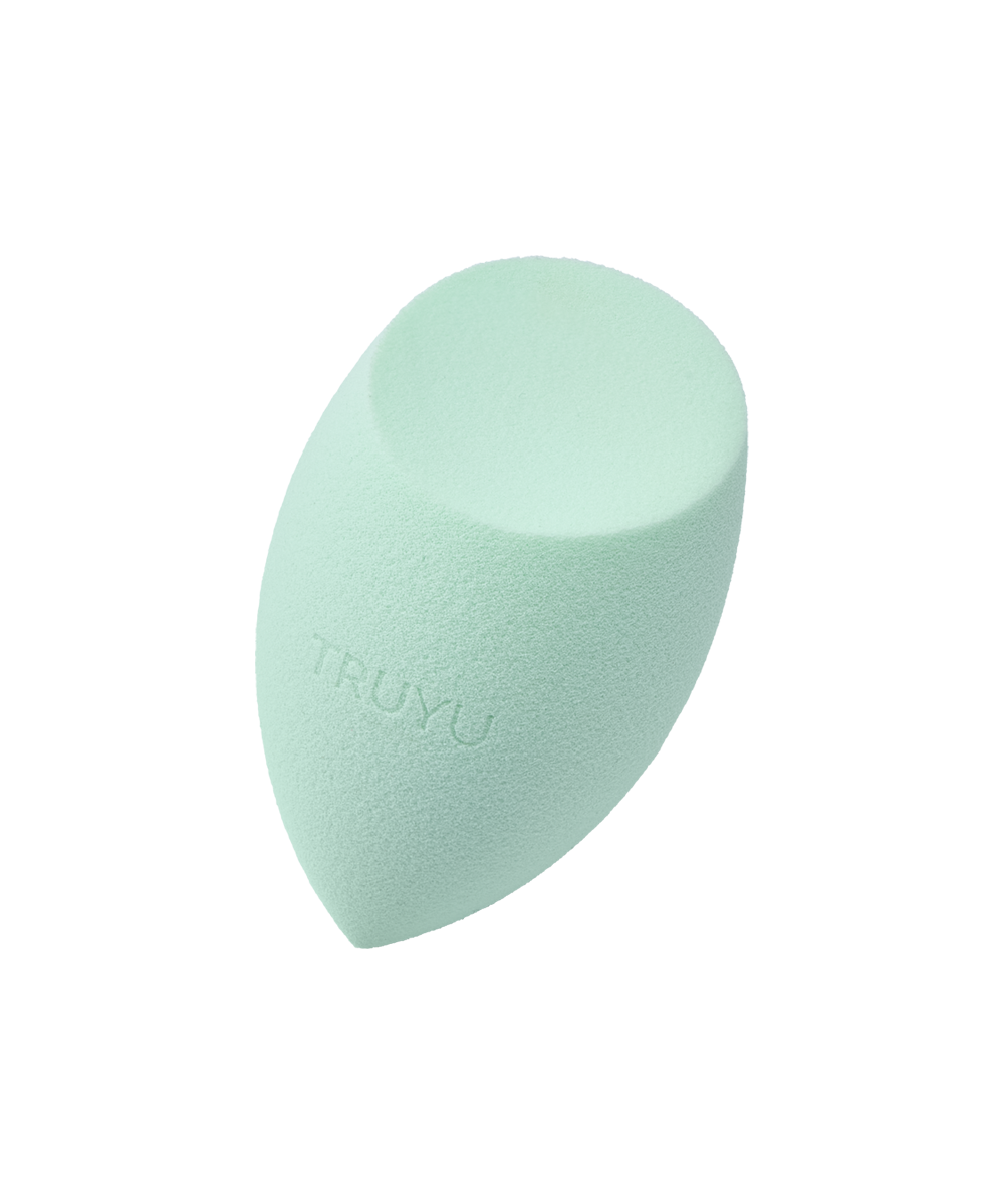 Angled image of mint green TRUYU Angled Blending Sponge.