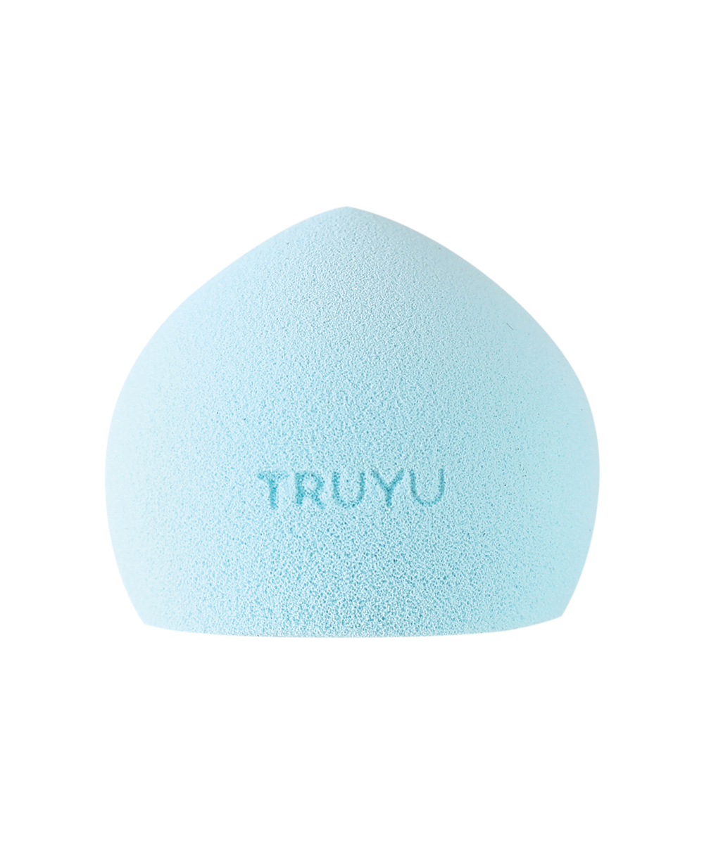 TRUYU Cloud Sponge. Out of packaging. Light blue coloured sponge, with TRUYU logo in centre. Dome shape, with flat bottom. (View 1)