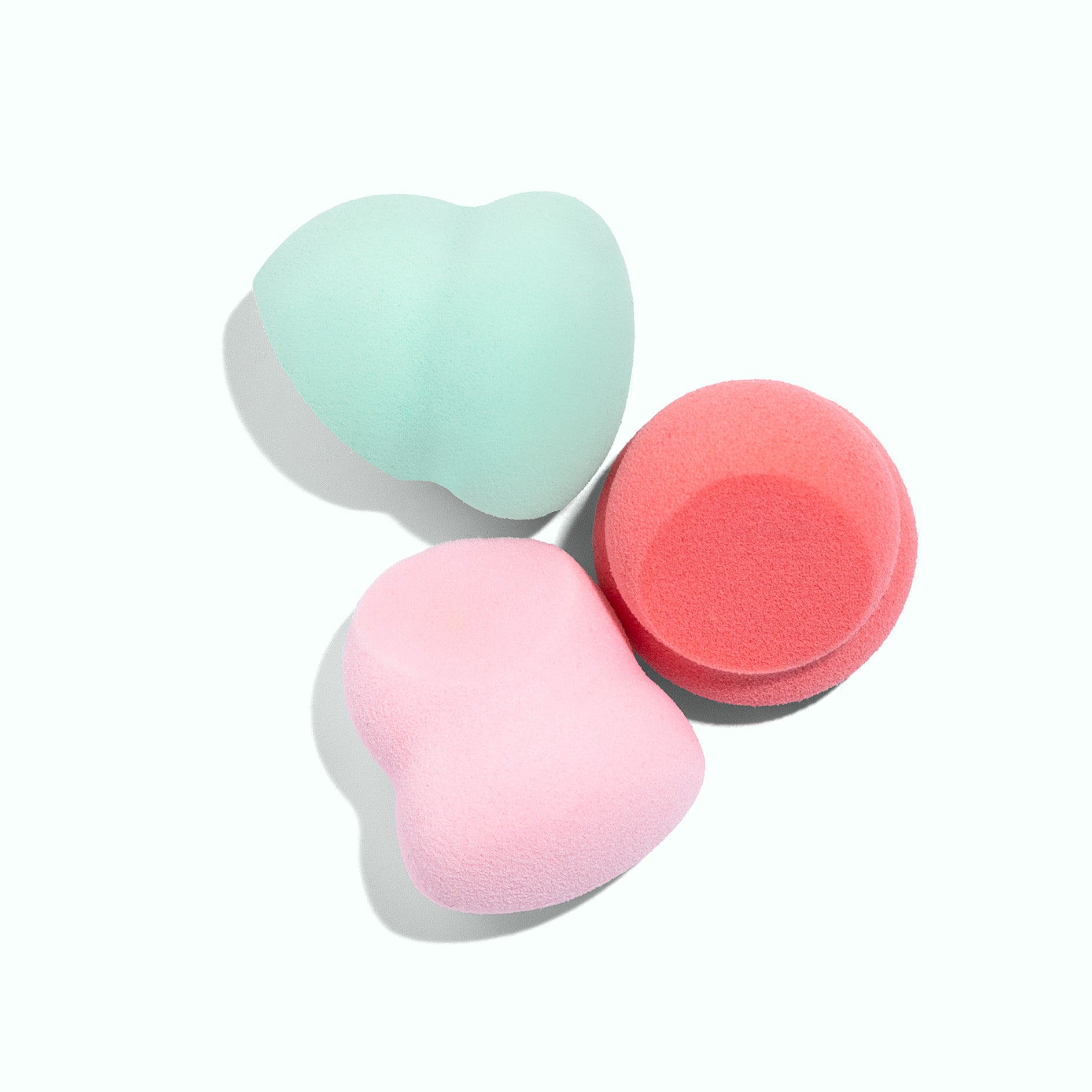 TRUYU Mini Blending Sponges. 3 Pack. Red, Pink and Blue. on blue background