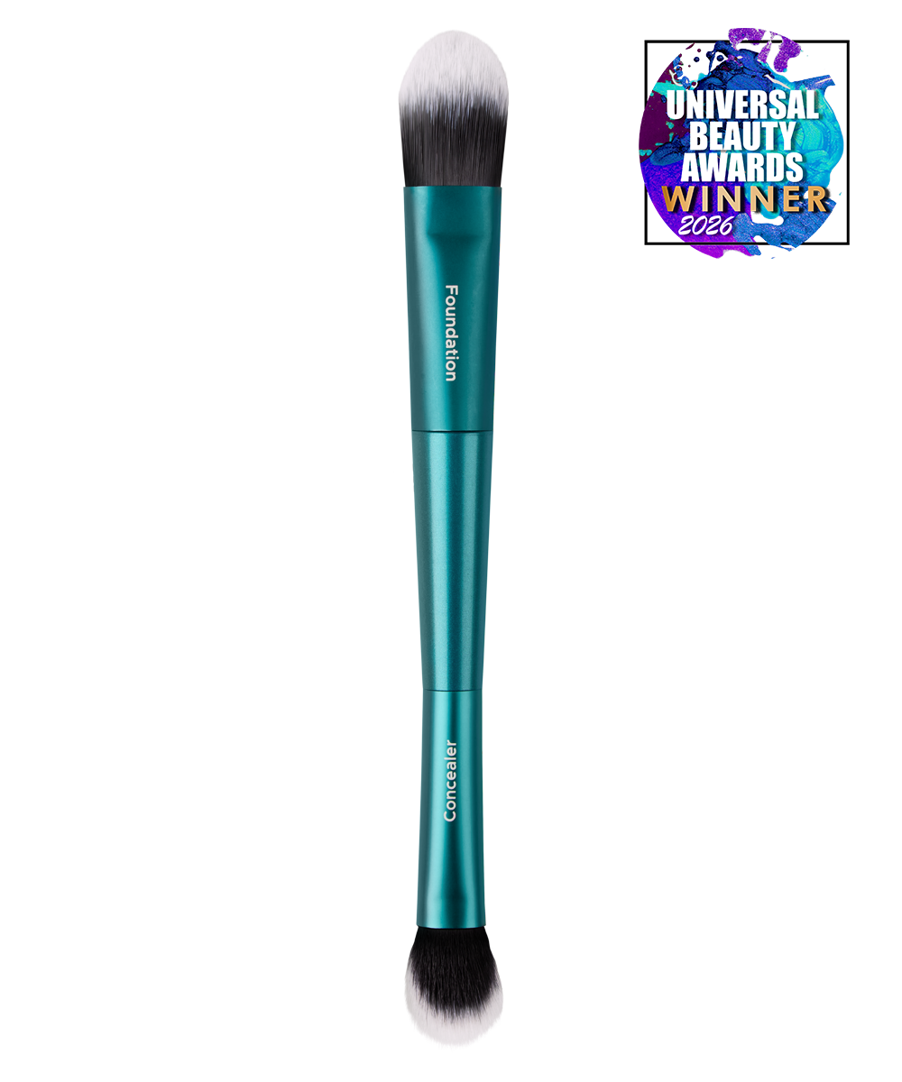Teal TRUYU Complexion Duo makeup brush with black bristles, featuring 'Universal Beauty Awards Winner 2026' badge. (View 1)