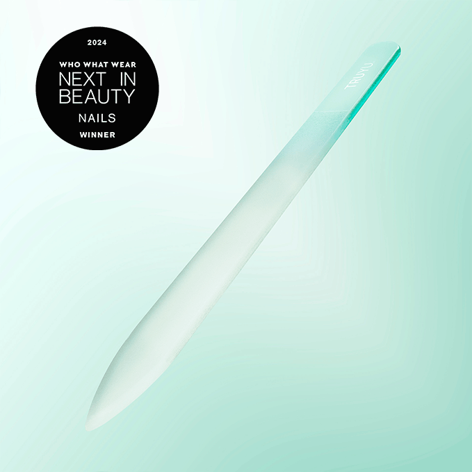 Image of floating TRUYU Glass Nail File on a mint green background. Who What Wear award roundel in top left corner.