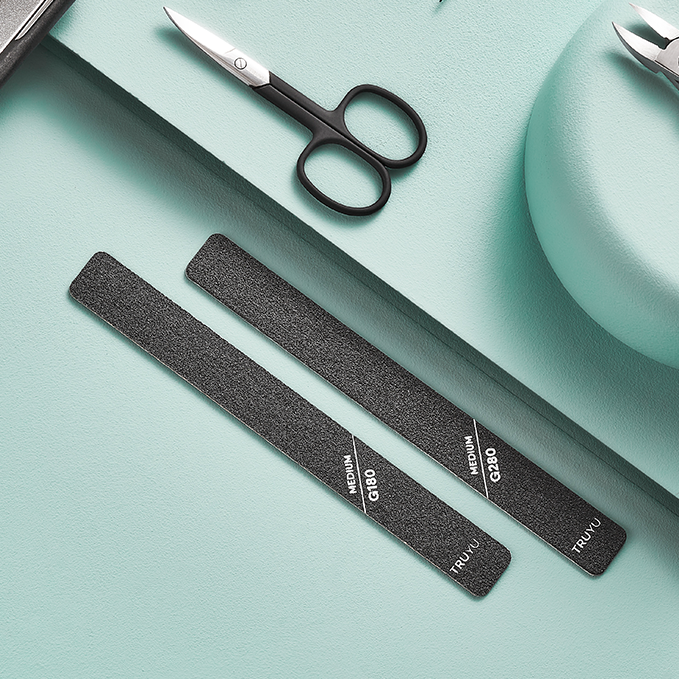 Image of TRUYU Pro Nail Files and Black Curved Nail Scissors on light blue coloured background.
