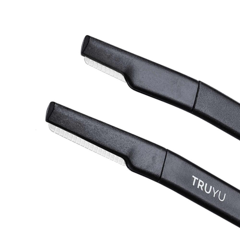 Zoomed in image of black TRUYU Facial Razors. Close up image showing silver facial and brow blades. 