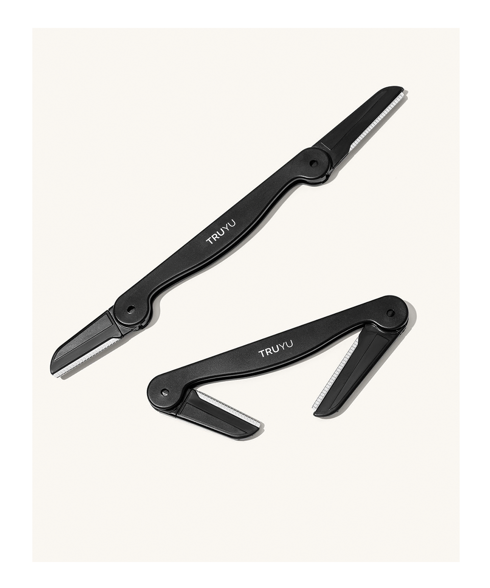 TRUYU Folding Facial Razors. Out of packaging. One razor fully open. One razor half open. 2 Different Blades. On neutral coloured background.