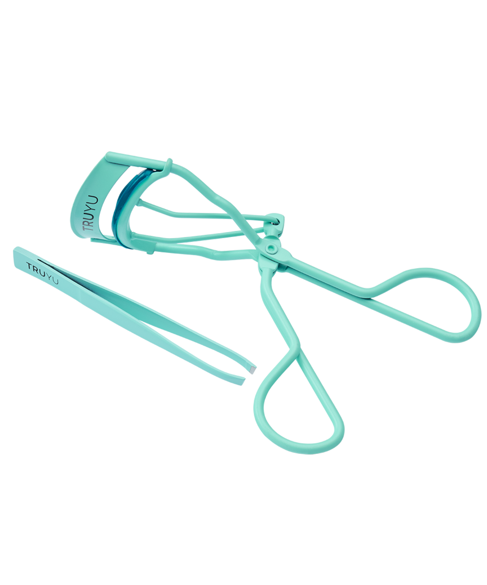 Angled Image of TRUYU Iconic Brow and Lash Set. Mint blue Eyelash Curler and Slant Tip Tweezer