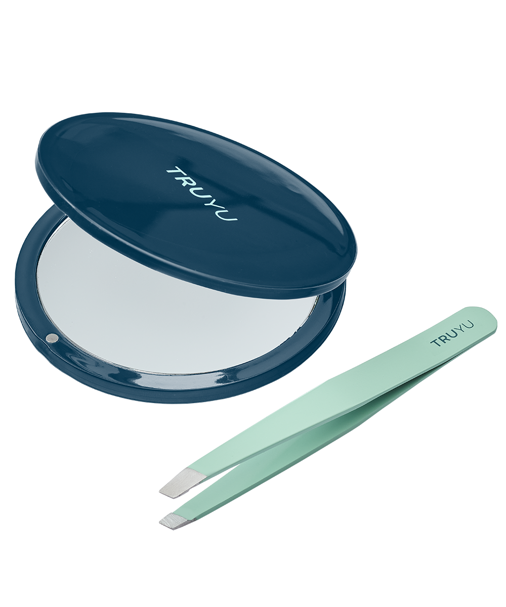 Angled image of TRUYU Compact Mirror & Tweezer Set. Half-open teal coloured Compact Mirror with mint coloured Slant Tip Tweezer. 